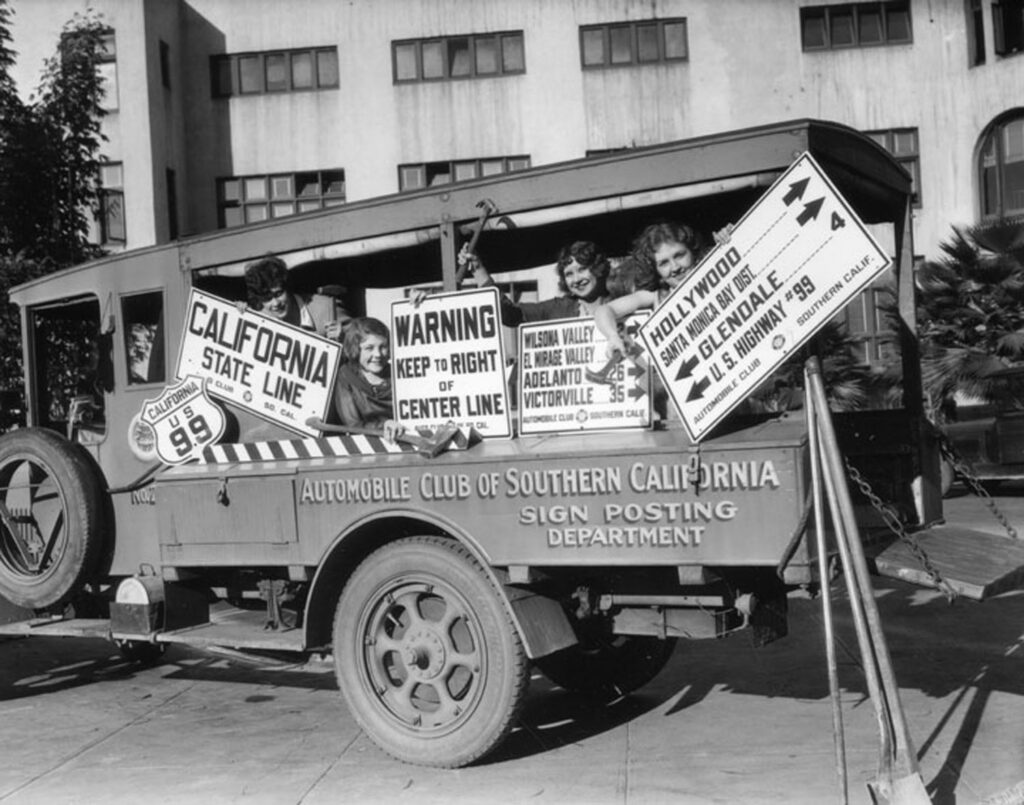 A Southern California Automobile Club truck loaded with road signs for installation or display.