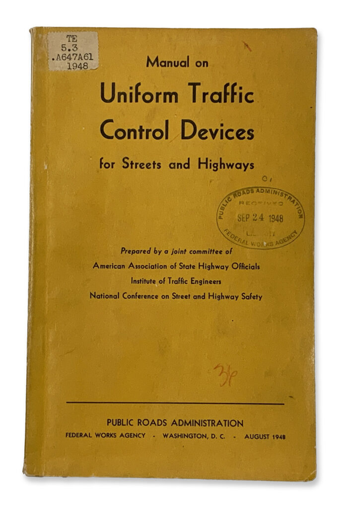 Yellow cover of a Manual on Uniform Traffic Control Devices for streets and highways.