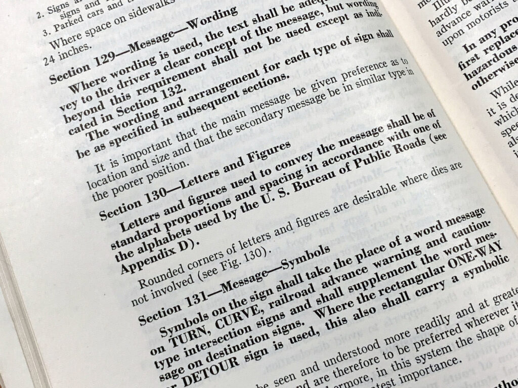 Close-up of a manual page discussing traffic-control standards and sign usage.