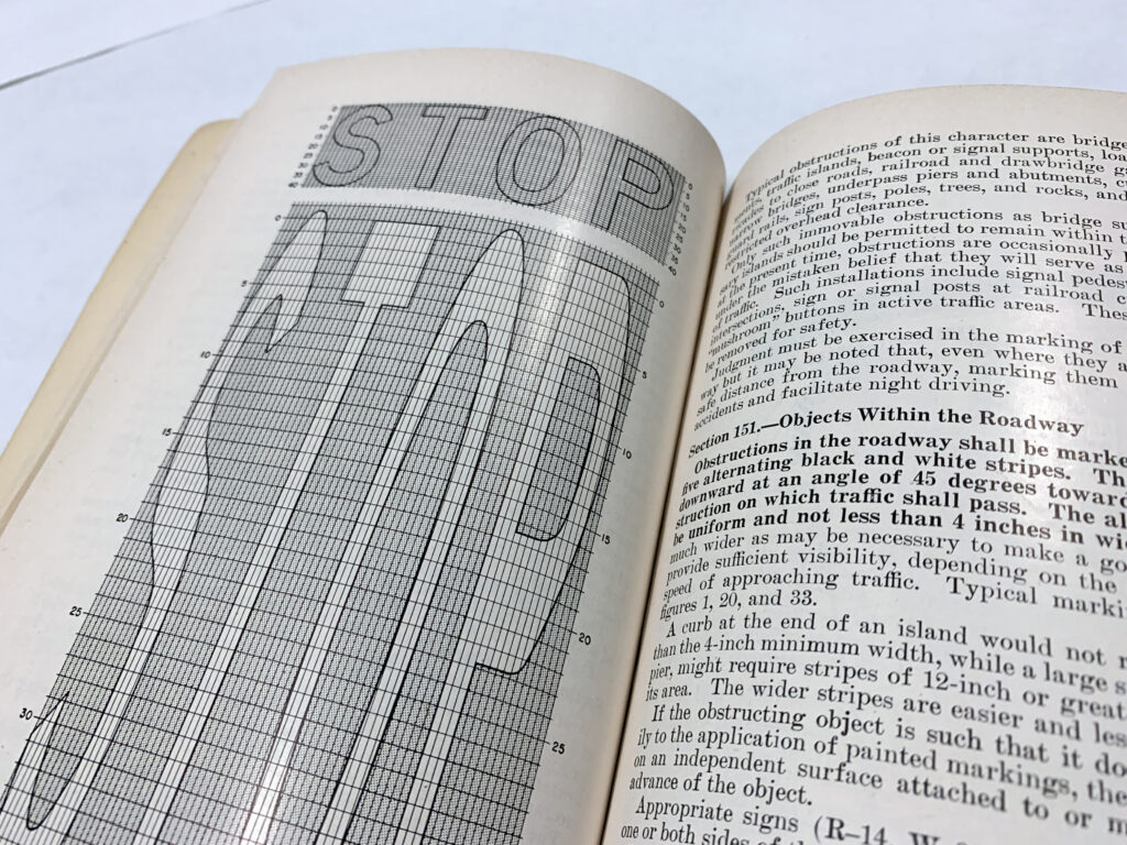 Open manual spread showing a stop sign specification and supporting text.