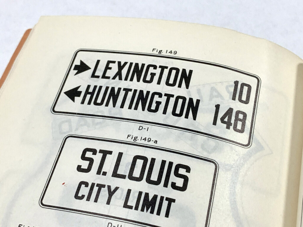 Open traffic-control manual showing Lexington, Huntington, and St. Louis guide signs