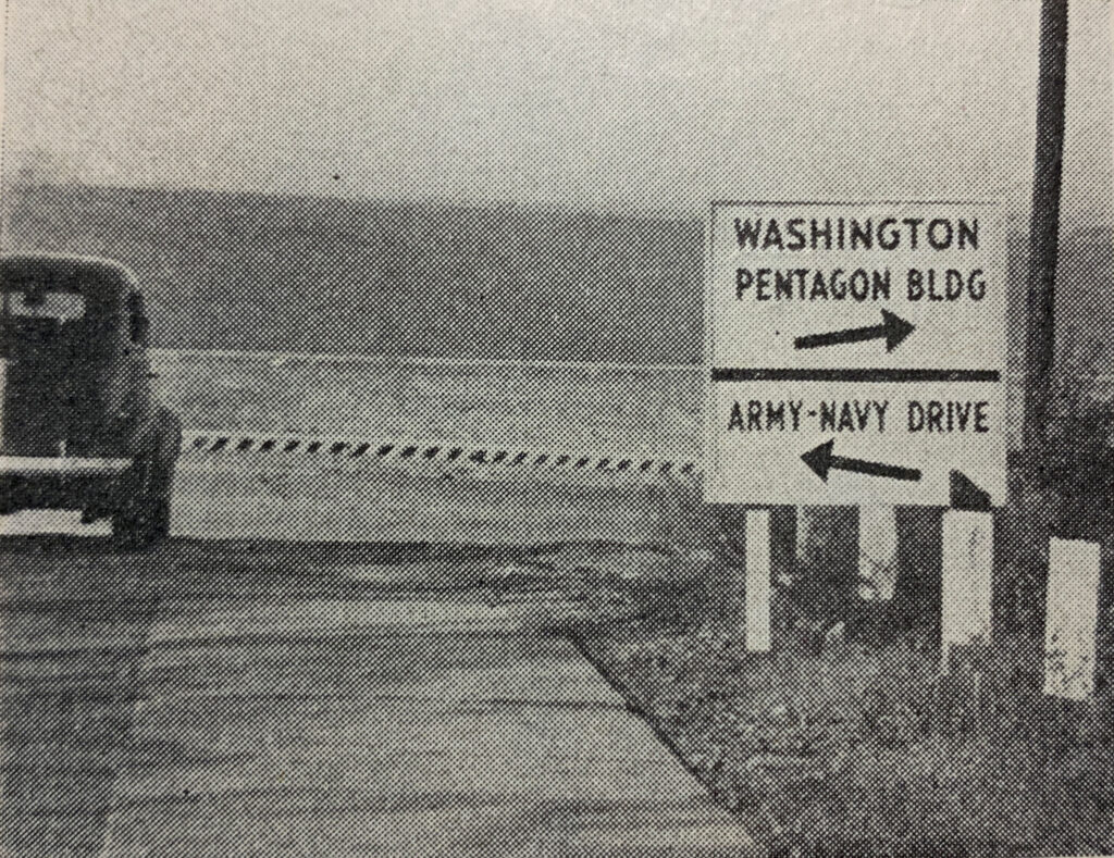 Archival photograph showing a Washington and Pentagon Building guide sign.